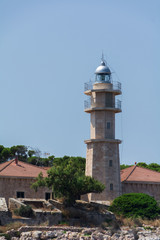 Obraz premium Port de Pollensa, Mallorca, Spain - July 19, 2013: Lighthouse Punta de la Avanzada