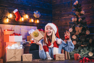 Home Christmas atmosphere. Positive human emotions facial expressions. Christmas tree decorate at home. Fashion portrait of girl indoors with Christmas tree. Open Mouth. Expressions face.