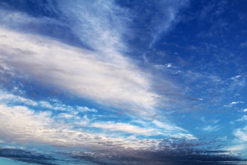 Naklejka na ściany i meble White and gray cirrus clouds against blue sky