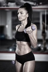 Fitness lady with dumbbells