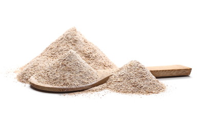 Fototapeta na wymiar Pile of integral wheat flour in wooden spoon isolated on white background