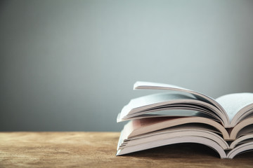 Open books on wooden table. Education concept