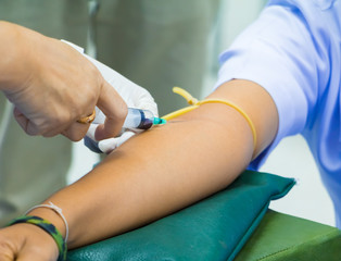 Medical selective syringe on arm patient to collect blood for test the health