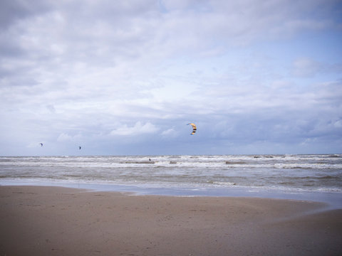 stormy beach day with clouds and kitesurfing at bloomingdale beach