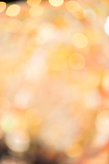 Gold bokeh abstract  glitter light on background. Golden christmas light shine bright holiday magic decoration.