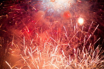 Fireworks. Stars and shiny fireworks on red background.
