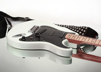 closeup.electric guitar with strap isolated on white background.