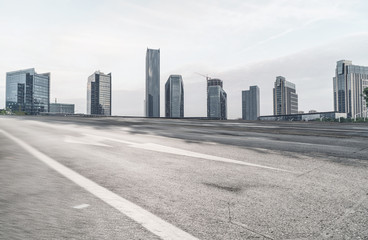 Panoramic skyline and buildings with empty road 