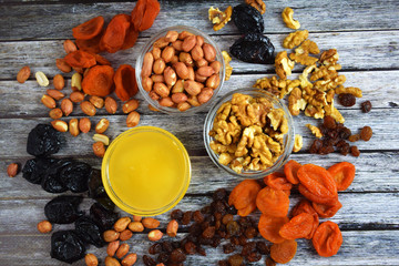 Dried fruits and honey on wooden background.Healthy.
