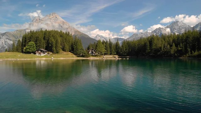 Arni lake (Arnisee) surrounded by Swiss Alps. Arni lake is a reservoir in the Canton of Uri, Switzerland.