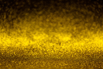 Abstract golden shiny sparkling glittering background.