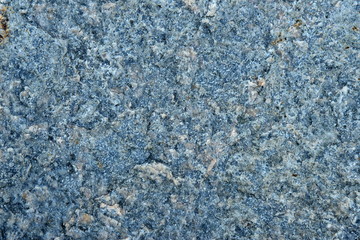Blue stone texture with marble surface, dark gray background.