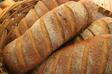 Pile of Fresh Made Whole Wheat Bread Loaves in a Basket  