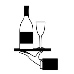 hand holding bottle champagne and glass