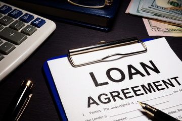 Loan agreement and money in an office.