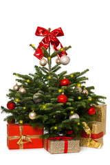 Christmas tree with a red bow and christmas gifts isolated on white background