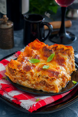 A slice of traditional homemade lasagna bolognese, selective focus