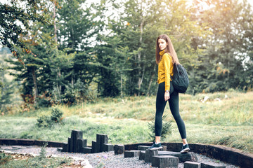 Brunette woman hiking in mountains.