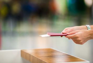 Closeup passports and boarding pass at airport indoor