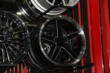 Alloy Wheel of car on the shelf. Alloy wheels are wheels that are made from an alloy of aluminium or magnesium. Alloys are mixtures of a metal and other elements.