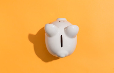 A piggy bank saving and investment theme on a orange background