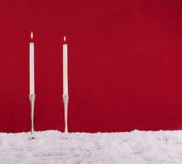 christmas silver candle on red background