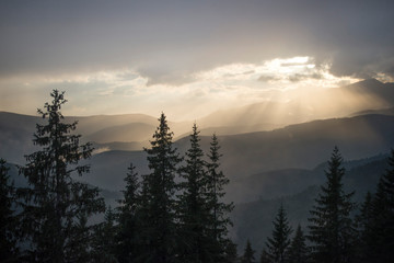 Sunrise in mountains on a cloudy day