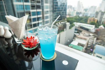 Refreshing tropical Lychee Blue Hawaii mocktail; Mixed of lychee juice and blue grenadine topped with soda water, on top on table at Cityview in Thailand