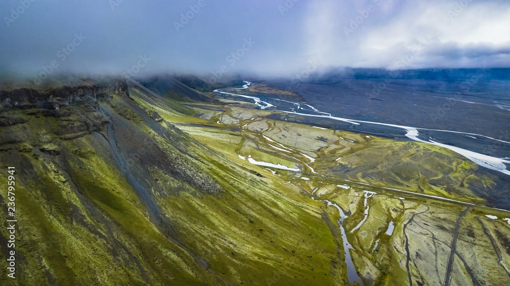 Poster aerial view of an icelandic landscape from close to the clouds