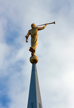 Sculpture of angel moroni atop of a Mormon Temple.
