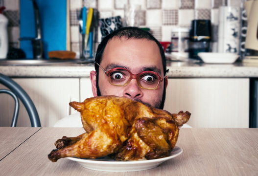 Funny Hungry Man Looking On The Chicken