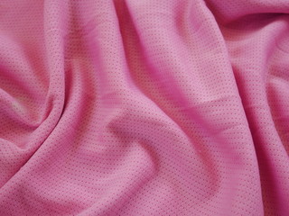 pink sportswear cloth texture background,silk fabric texture,pink background