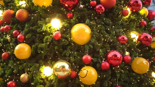 Christmas tree decorated with fancy sparkly Christmas tree toys and shining lights