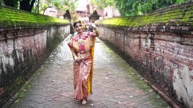 Thailand traditional or cultural dance. Thai beautiful girl is dancing called Ram, it is noble Thai art of elegance.