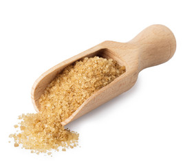 brown cane sugar in wooden scoop
