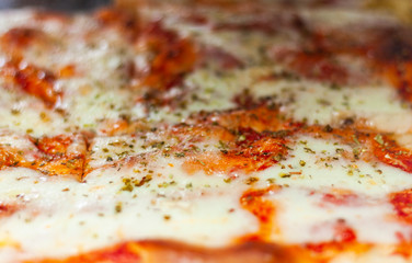 Pizza Margherita with tomatoes, mozzarella fior di latte, fresh basil, salt and extra-virgin olive oil 