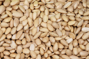 Raw cleaned white almonds as background/texture