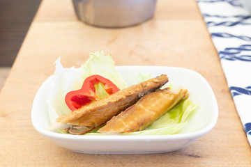 Mediterranean herring fish mezze on wood
