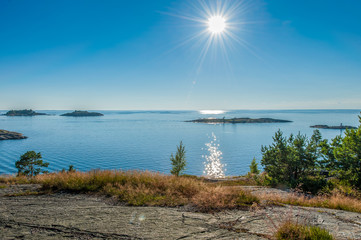 Sunny seascape with sun and reflections