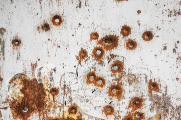 Texture of old rusty metal sheet with bullet holes on it - obrazy, fototapety, plakaty