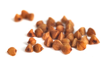 Buckwheat grain isolated on white background, healthy wood