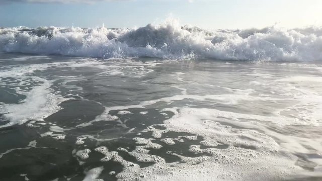Blue waves surfing on ocean tropical beach