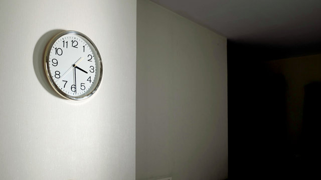 modern stainless round  frame clock on white wall