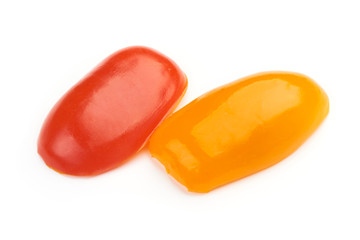 Fresh Sliced Red and Yellow cherry tomatoes, isolated on a white background