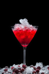 cosmopolitan cocktail and frozen cranberry berries with ice Christmas holiday