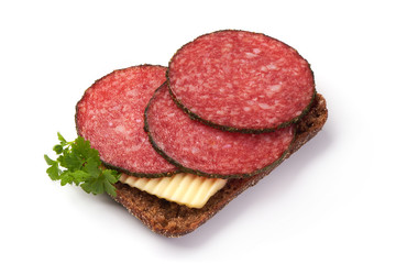 Salami Sausage Sandwich with parsley, isolated on a white background. Close-up