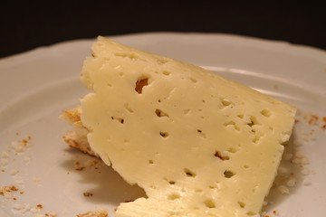 Fresh pretzel with sausage and cheese is a tasty snack