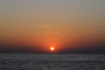 Travel to Slovenia.Travel to Slovenia. Red-orange stunningly beautiful sunset on the Adriatic Sea coast in Slovenia