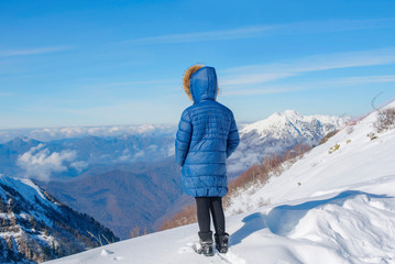 Fototapeta na wymiar portrait of a girl in the snowy mountains