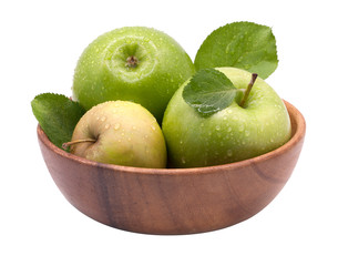 Green apples in a wooden bowl.